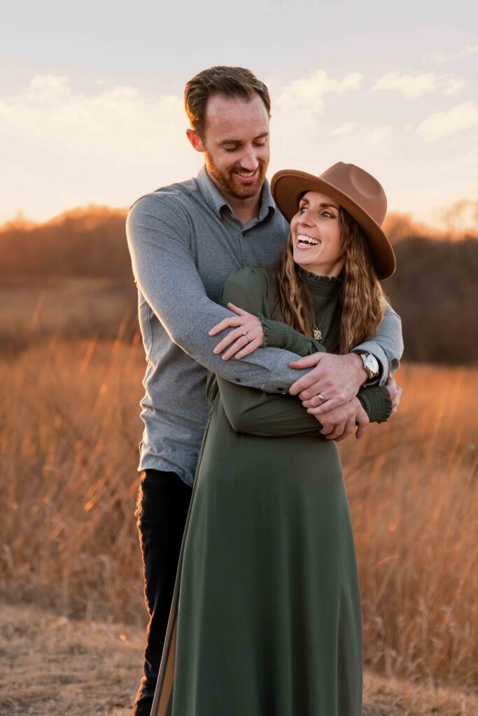 Happy couple at photography session in Missouri sunset.