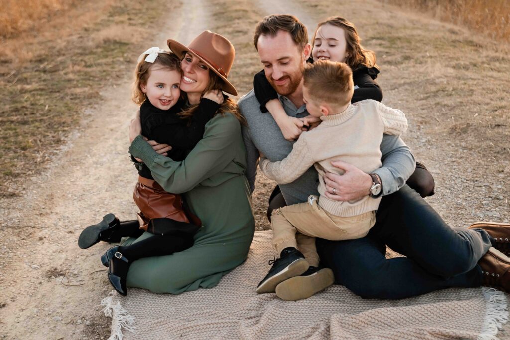 A happy family snuggles at Busch Conservation Area. 