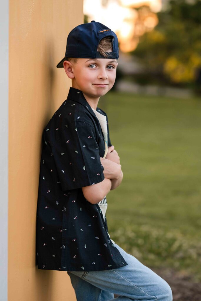 Eleven-year-old boy standing for a portrait in St. Louis at Laumeier Sculpture Park.