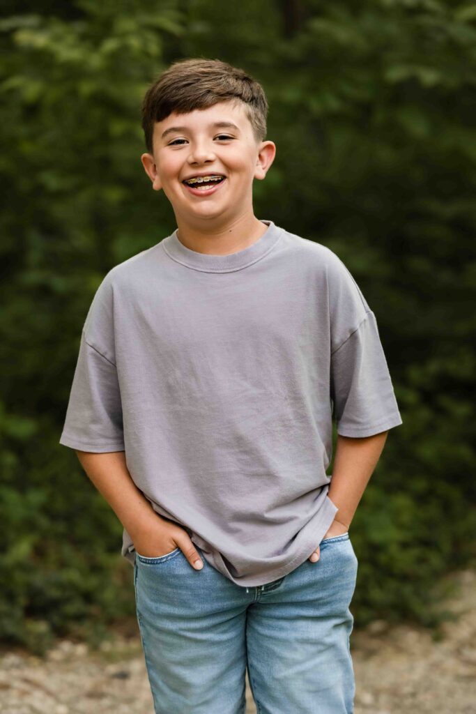 Nine-year-old boy smiling for photos in St Louis, Missouri